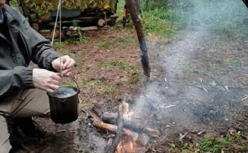 Solo bushcraft survival in a forest at night with minimal gear